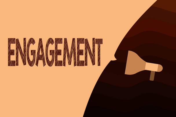 Handgeschreven tekst Engagement. Concept, wat betekent dat formele overeenkomst om getrouwd regeling om iets te doen - Foto, afbeelding