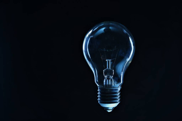 incandescent light bulb on black background - Foto, Imagem