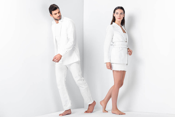 adult stylish barefoot couple in total white  - Φωτογραφία, εικόνα