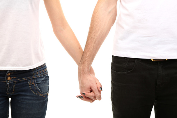 Young loving couple holding hands isolated on white - Foto, Imagem
