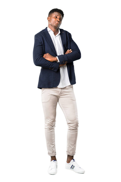 Full body of Handsome african american man wearing a jacket making unimportant and doubts gesture while lifting the shoulders on white background - Foto, imagen