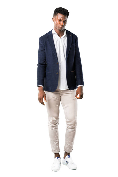 Full body of Handsome african american man wearing a jacket with sad and depressed expression. Serious gesture on white background - Foto, Imagen