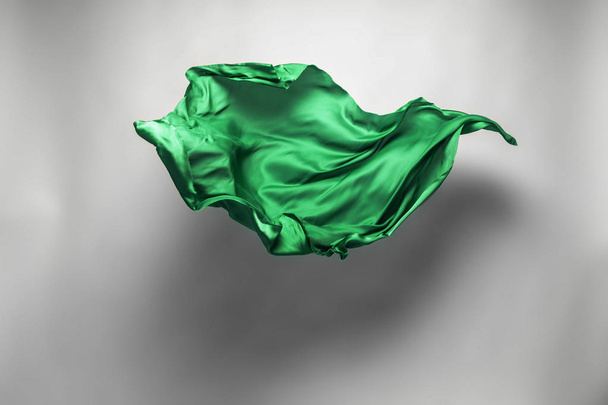 abstract piece of green fabric flying, high-speed studio shot - Foto, Imagen