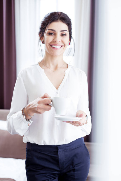 Nice confident businesswoman starting her working day - Foto, immagini