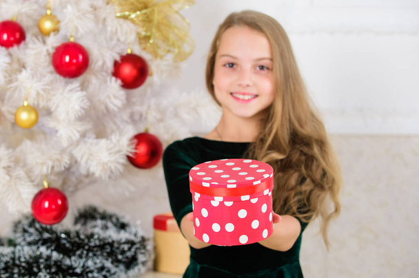 Opening christmas presents. Dreams come true. Best for our kids. Kid girl near christmas tree hold gift box. Child celebrate christmas at home. Favorite day of the year. Time to open christmas gifts - Foto, Imagen