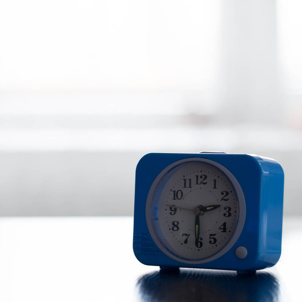 Old alarm clock as a symbol of time management. - Foto, imagen