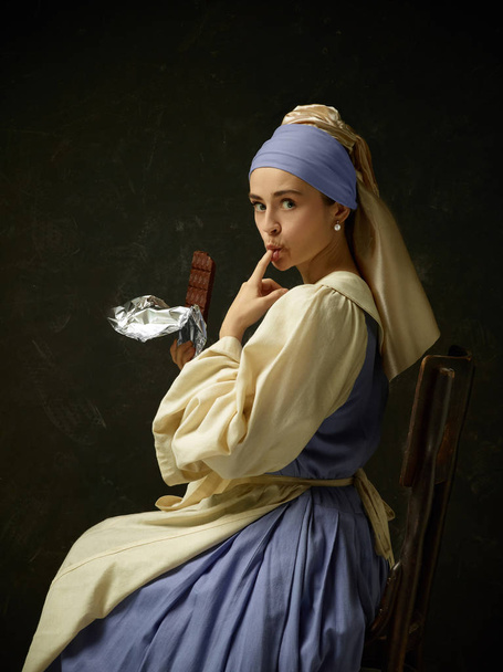 Medieval Woman in Historical Costume Wearing Corset Dress and Bonnet. - 写真・画像