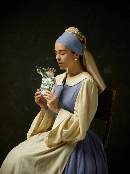 Medieval Woman in Historical Costume Wearing Corset Dress and Bonnet. - Φωτογραφία, εικόνα