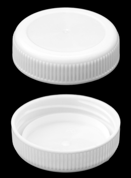 deux côtés d'un bouchon de bouteille en plastique blanc
 - Photo, image