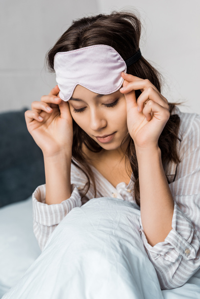attractive girl with sleeping eye mask on head - Photo, Image