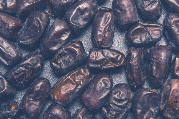 Black dates healthy dried fruits - Foto, immagini