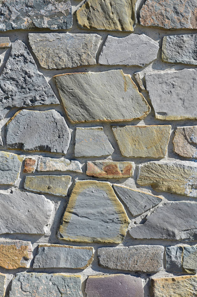 Revestimiento de pared con una piedra triturada. Textura
. - Foto, imagen