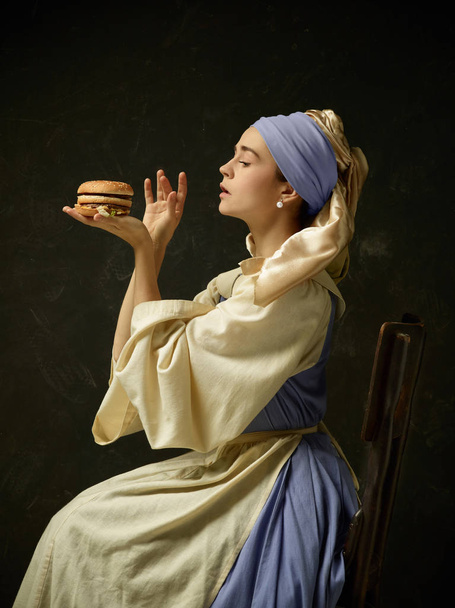 Medieval Woman in Historical Costume Wearing Corset Dress and Bonnet. - Fotografie, Obrázek