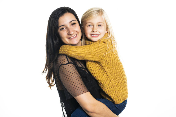 A mother and daughter on studio white background - Foto, Imagen