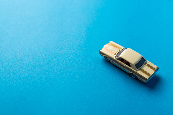 close up view of toy car on blue background, minimalistic concept - Foto, Bild