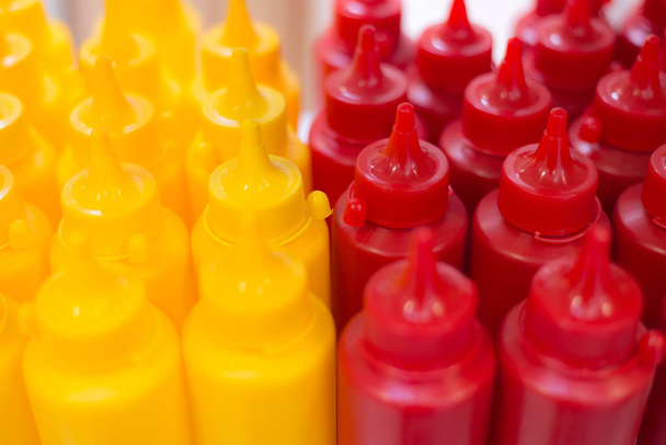 selective focus of bottles with ketchup and mustard - Zdjęcie, obraz