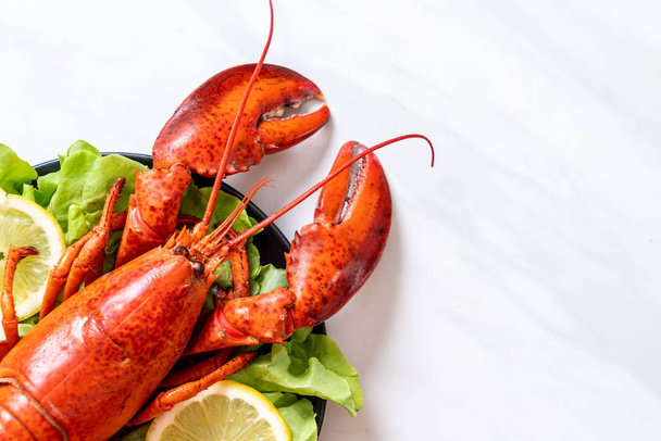 freshly boiled lobster with vegetable and lemon - Photo, image
