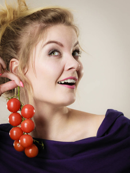 Organic vegetables and food concept. Happy positive smiling woman holding fresh cherry tomatoes - Φωτογραφία, εικόνα