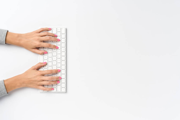 Woman using computer keyboard - Фото, изображение