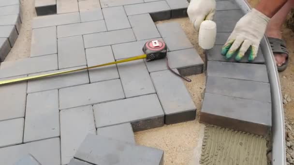 Laying Paving Slabs Close-Up. Road Paving, Construction. - Materiaali, video