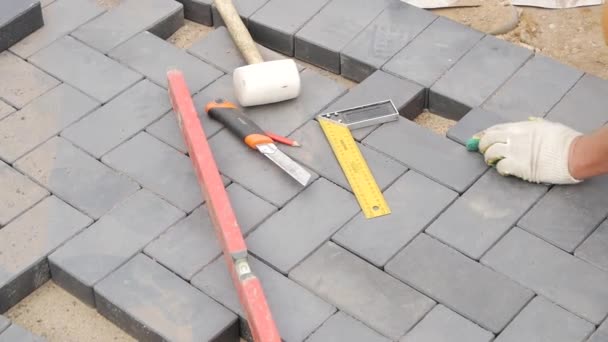 Laying Paving Slabs Close-Up. Road Paving, Construction. - Video, Çekim