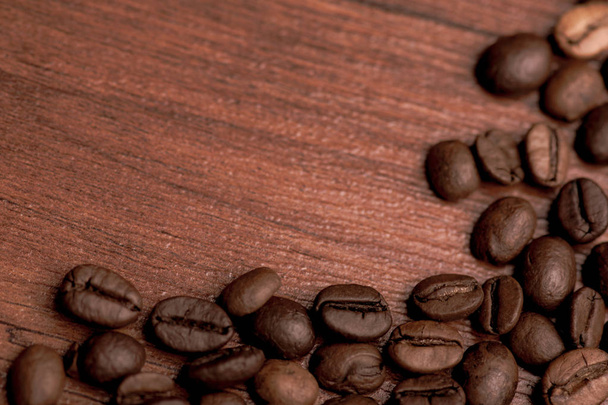 Cafe design, pictures for bars and cafes. Closeup coffee grains on burlap and brown background. - Fotó, kép