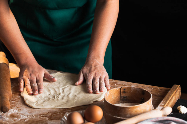 Hands of a chef baker woman kneading dough - Photo, Image