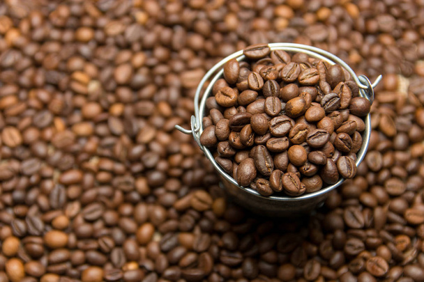 Coffee beans background in toy metal bucket - Foto, Imagem