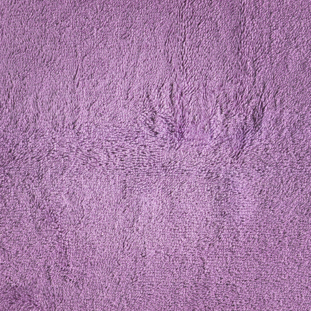 Ультрафиолетовый фон текстуры инструмента. Фиолетовое махровое полотенце
 - Фото, изображение