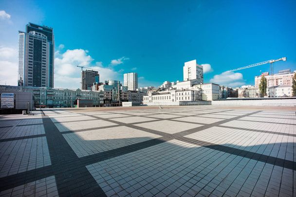 Olimpiyskiy square with paving stones and nobody on shot with big dynamic range, blue sky and colorful space - Photo, Image