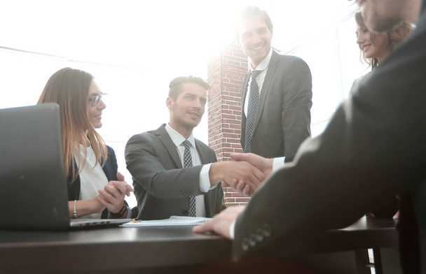 shaking hands after a business meeting in the office - Photo, Image