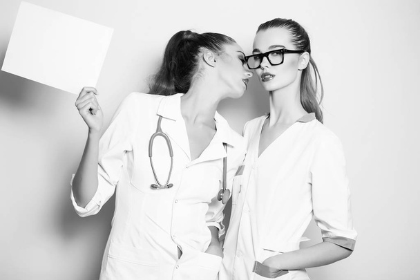 women doctors going to kiss on sexy lips - Foto, imagen