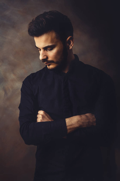 Portrait of young man in art studio - Fotografie, Obrázek