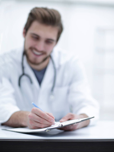 background image of a doctor writing out a prescription - Foto, Imagem