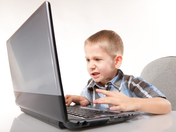 Computer addiction emotional boy with laptop - Foto, Bild