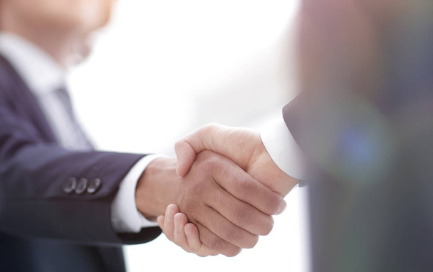 Two businessman shaking hands greeting each other - Fotó, kép