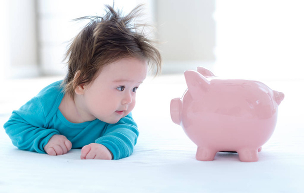 Baby boy with a piggy bank - Photo, Image