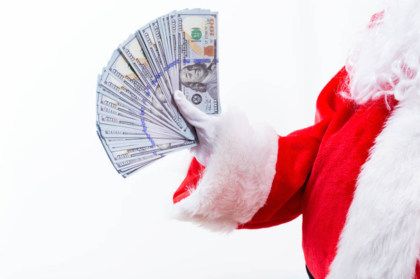 Santa holding US dollar bills - Фото, зображення