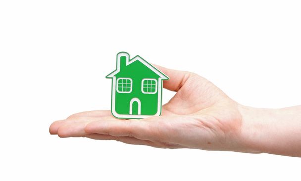 pictogram van een hand bedrijf groen huis - Foto, afbeelding