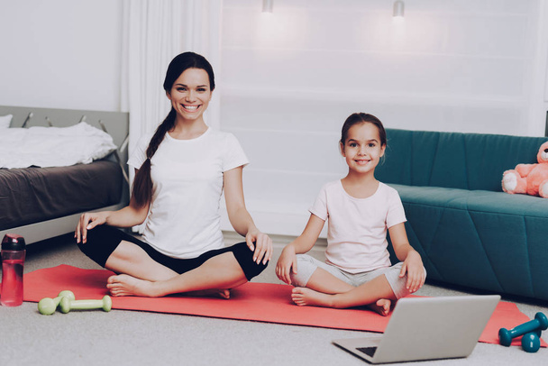 Athletic Day For Yoga. Young Woman and Young Girl Fitness Together. Yoga at Home with Daughter Happy Girl Relaxation. Motivation for People. Sport for Young People. Healthy Woman Gymnastics at Home. - Zdjęcie, obraz