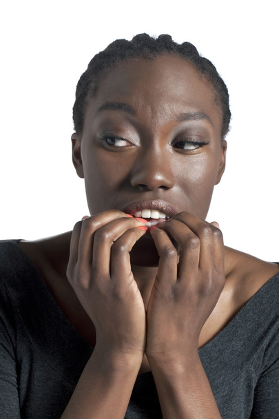 a stressed woman biting her nails - Foto, Bild