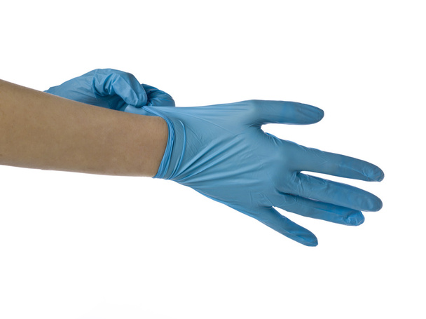 een chirurg dragen van medische handschoenen - Foto, afbeelding