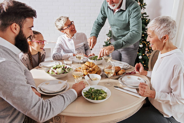 Family gathered over for Christmas holidays, celebrating, having lunch  - Zdjęcie, obraz