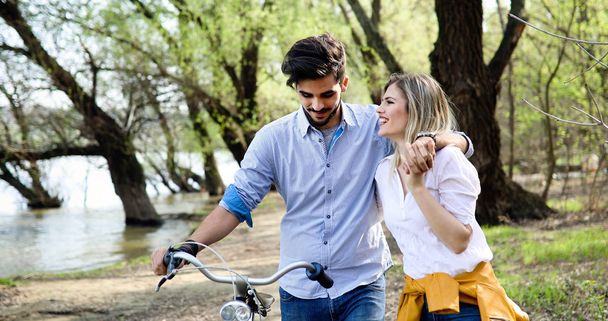 Beautiful couple in love riding bicycle in city and dating - Photo, Image