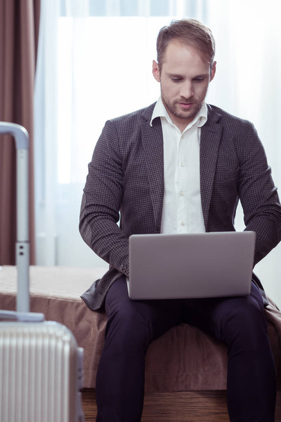 Bearded businessman writing business letters after business flight - Photo, Image