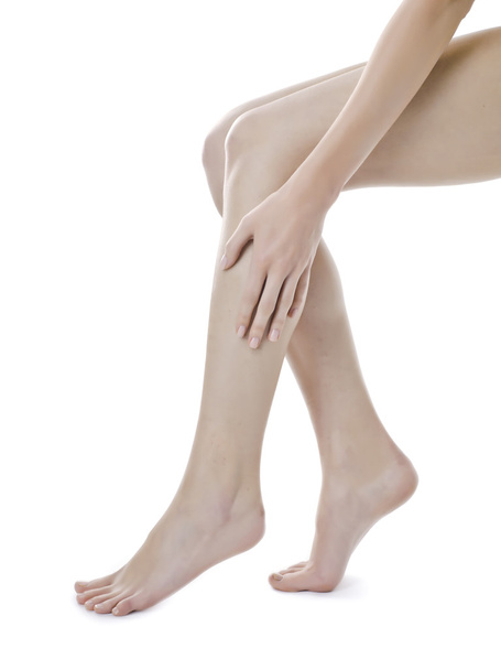 une femme touchant ses jambes
 - Photo, image