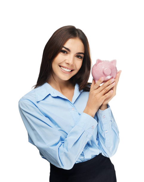 Beautiful young woman with piggy bank on white background - Photo, Image