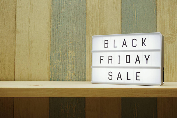 black friday sale shopping concept alphabet on wooden background - Foto, imagen