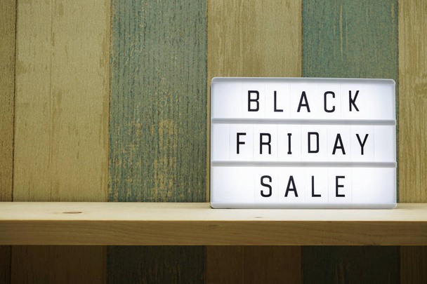 black friday sale shopping concept alphabet on wooden background - Foto, afbeelding