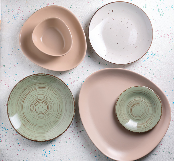 Set of clean color plates on table - Photo, Image